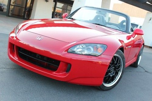 2005 honda s2000. red/blk.6 sp. custom wheels. low miles. nice car.