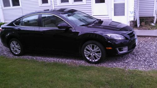 Black w/ tan leather interior, sunroof, heated seats,