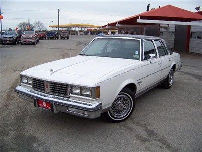 1987 4dr sedan brougham 3.8l auto white