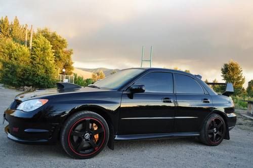2007 custom blacked out tuned sti well taken care of!