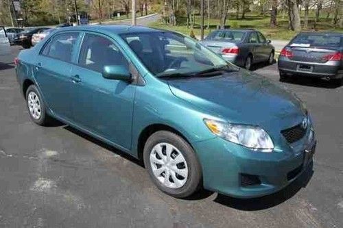 Teal green 2010 toyota corolla le sedan 4-door 1.8l