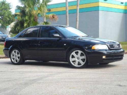 2.7t bi-turbo black over off white leather 6 speed manual sunroof