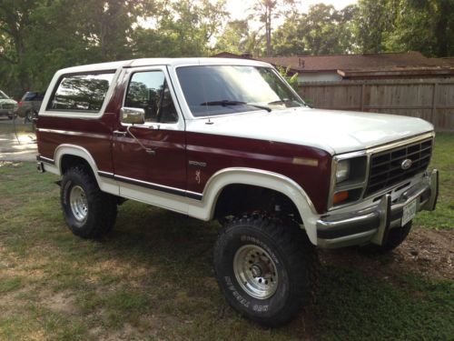 Maroon and white mud slinger with rebuilt motor and transmission