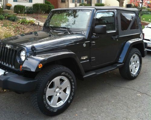 2010 jeep wrangler sahara, factory hard top and a new soft top, hitch, like new