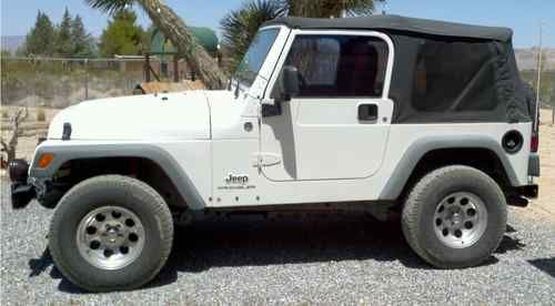 2005 white jeep wrangler, runs perfect, 94,500 miles.