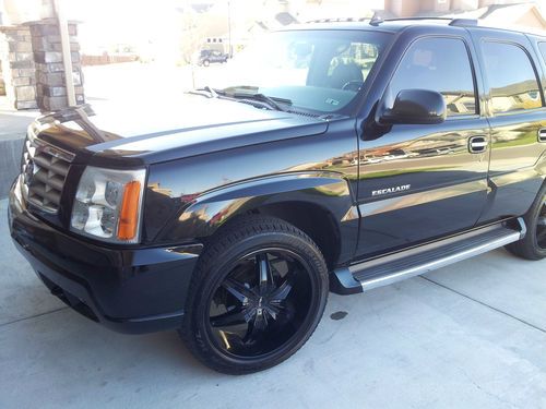 2006 black cadillac escalade on 22" rims