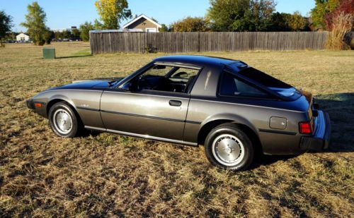 1980 mazda rx-7 26.5k miles rear hatch reflects a mid-engine ferrari