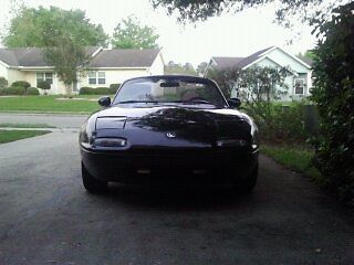 1993 mazda miata mx-5 roadster, black with camel top and leather seats.