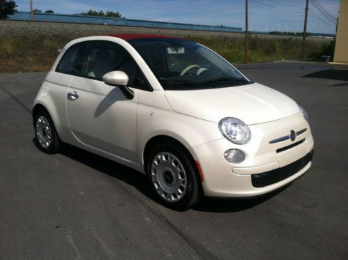 White two door red interior roof folds back very clean carfax one previous owner
