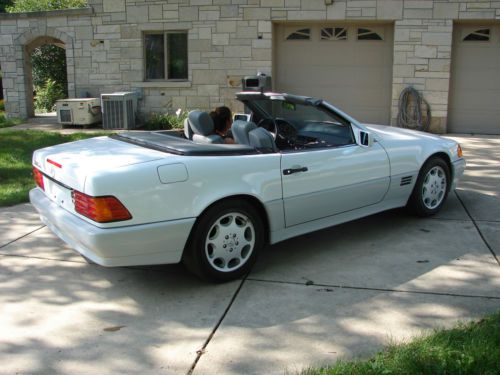 White with grey trim, convertable cloth and hard top in excellent condition