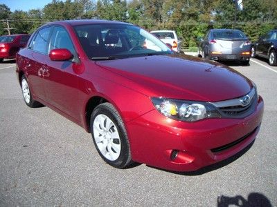 2011 impreza, 5 speed manual, awd, 4 door, 2.5l, cd, a/c, 22k miles, red