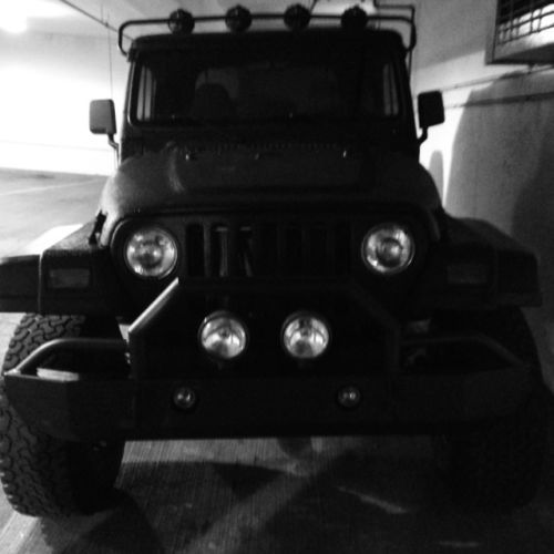 Black custom rhino lined and lifted 1997 custom jeep wrangler spor,t runs great