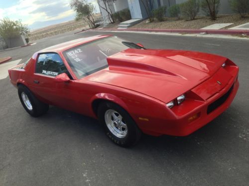 1985 red chevy camaro drag car