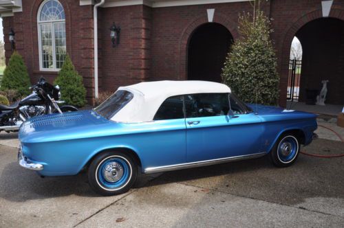 Cheverolet corvair convertible.  bule two door.  white top