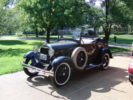 Rose beige color, rumble seat roadster covertible in excellent condition