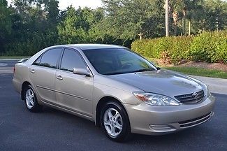 2004 toyota camry  le gold leather, alloy, runs and looks great, best deal.