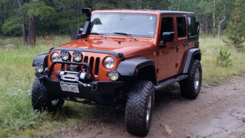 2011 jeep wrangler unlimited  sport utility 4-door 3.8l v6 mango tango lifted!!!