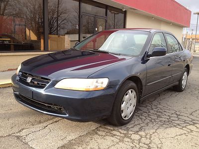 00 honda accord  lx, 2.3l ,5speed, 4door ,great on gas,looks and runs great !!!!