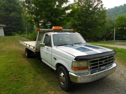 Ford f-350 rollback with a 1994 cab on it.