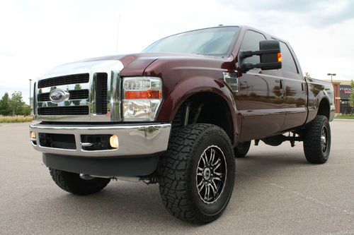 F-250 crew cab lariat turbo diesel 4x4 30k lifted new tires new wheels rear cam