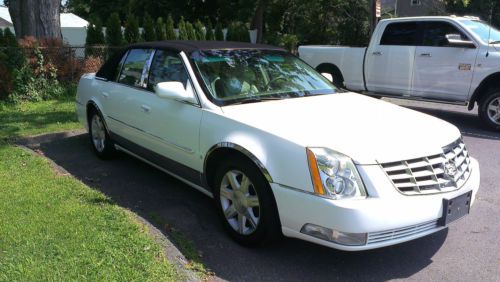 Low mileage cadillac deluxe touring sedan with trim upgrades