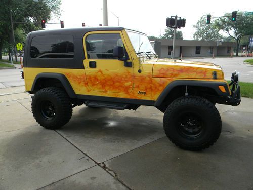 2006 jeep wrangler unlimited 2d ,custom paint , lift kit, 33 tires , must see
