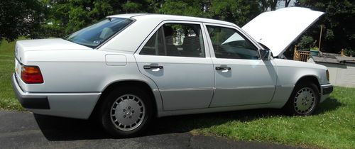 You're looking at a 93 mercedes benz in artic white that needs some tlc