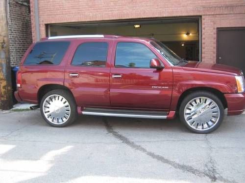 2003 cadillac escalade with 24" greed rogue chrome rims