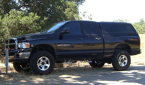 2004 dodge 325cummins diesel4x4_35"toyo_leer_yakima_bedrug_banks_kore lift_1ownr