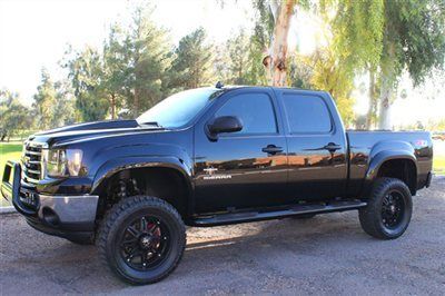 Lifted custom southern comfort black widow ltz 4x4 navigation fabtech lift