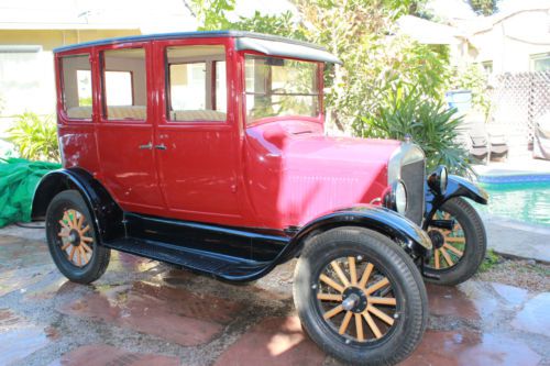 Crimson red  four door sedan