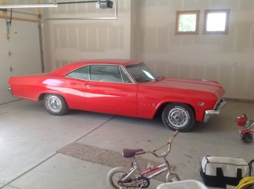 1965 2 door. red with white interior. 402ci, 4 speed, 411 rear gear.