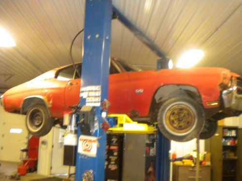 Up for bid i have a 1970 chevelle 396 ss originally red with white stripes/top
