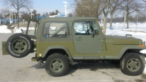 1988 jeep wrangler yj , 6 cyl, condition fair,green od paint,has hard top
