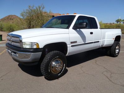 02 3500 1ton 4x4 dually 5.9 h.o. diesel 6-5 speed lifted like new cond serviced!