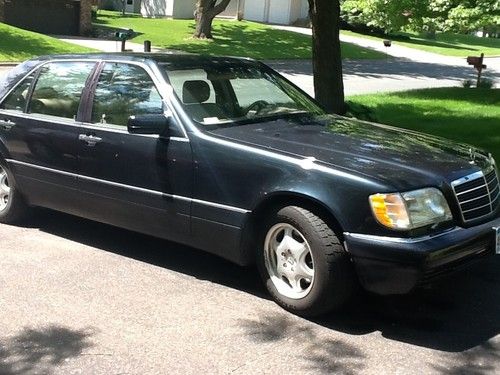 Navy blue w/ tan interior, good condition, bose sound system, power options.