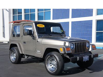 Jeep 4.0l 4x4 sport 4 speed automatic khaki mp3 4 speakers power roll bar tilt