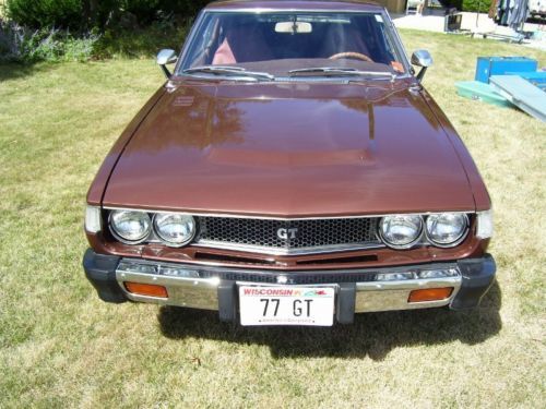 Copper metallic color, excellent condition, liftback style and air conditioning