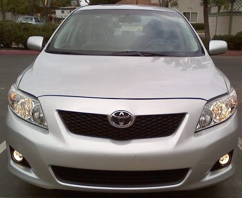 2010 toyota corolla silver , low milage ,very clean