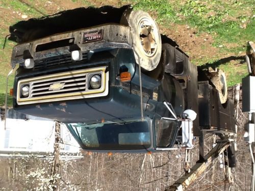 A 1975 chevrolet c60 service truck with service bed and auto crane