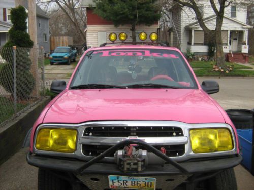 1999 chevy tracker swing hatchback 4-door 2.0l pink