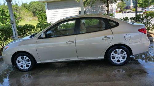 Gold hyundai elantra 4 door sedan