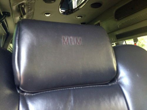 9 passenger,totally blacked out w/ ground effects, all black leather interior., image 6