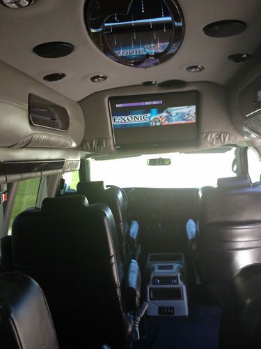 9 passenger,totally blacked out w/ ground effects, all black leather interior., image 8