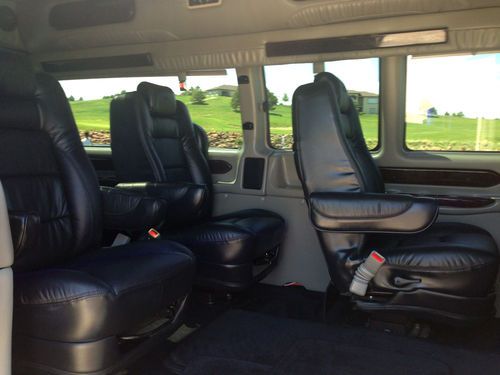 9 passenger,totally blacked out w/ ground effects, all black leather interior., image 9