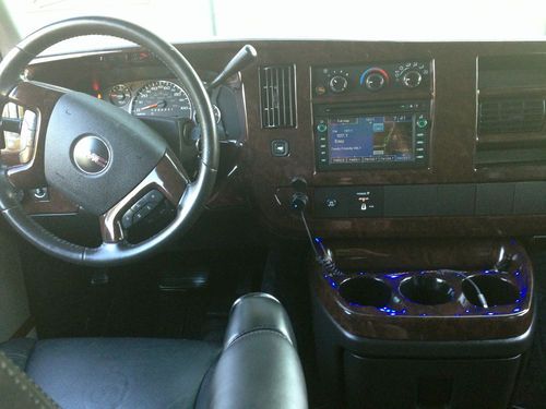 9 passenger,totally blacked out w/ ground effects, all black leather interior., image 11