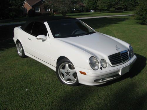 Stunning 2000 convertible rebuilt title, like new.upgraded amg rims.