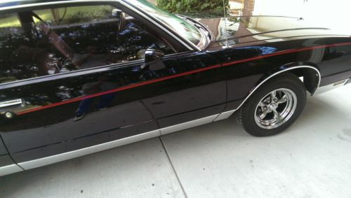 Beautiful black chevy monte carlo for sale. 2 door coupe with burgundy interior.