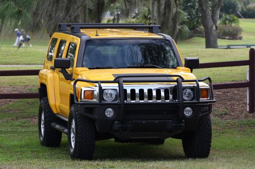 Yellow, stick shift, brush guard, h2 roof rack, dual res, tow package