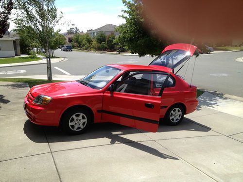 2004 hyundai accent , less than 24k miles, red and grey